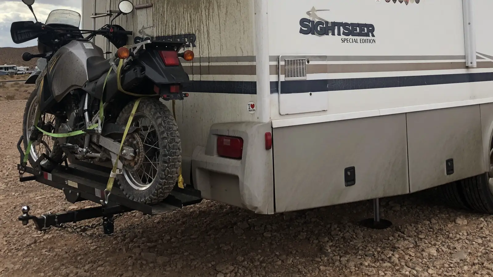flat towing vehicle with a motorcycle on RV